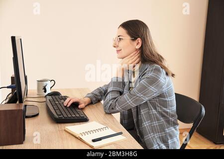Mature woman using desktop at home Stock Photo
