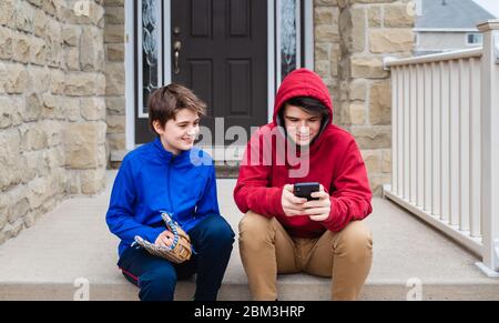 two teenage boys talking