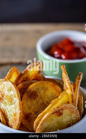 Home-made oven fried potato chips.