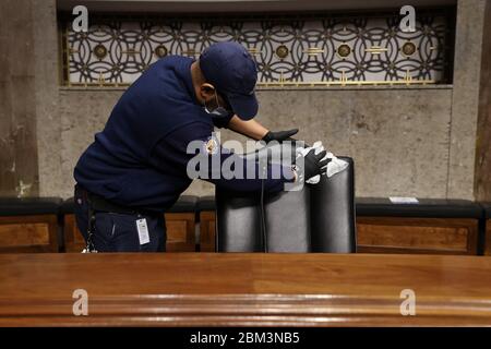 Washington, United States Of America. 06th May, 2020. Workers change linens, wipe down chairs between Senate committee hearings in the Dirksen Senate Office Building on Capitol Hill during the coronavirus disease (COVID-19) outbreak in Washington, U.S. May 6, 2020. Credit: Jonathan Ernst/Pool via CNP | usage worldwide Credit: dpa/Alamy Live News