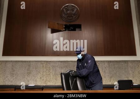 Washington, United States Of America. 06th May, 2020. Workers wipe down chairs between Senate committee hearings in the Dirksen Senate Office Building on Capitol Hill during the coronavirus disease (COVID-19) outbreak in Washington, U.S. May 6, 2020. Credit: Jonathan Ernst/Pool via CNP | usage worldwide Credit: dpa/Alamy Live News Stock Photo