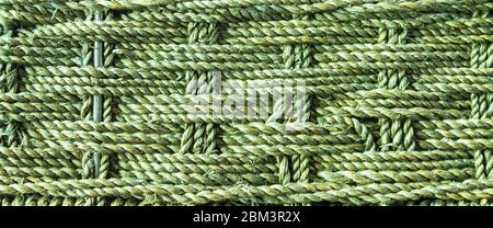 Close-up of woven rattan basket in green Stock Photo