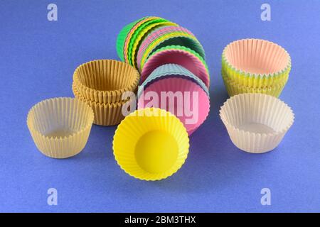 Different kinds of muffin and cupcake cups with parchment paper muffin cups, silicone parchment cups and traditional paper muffin cups Stock Photo