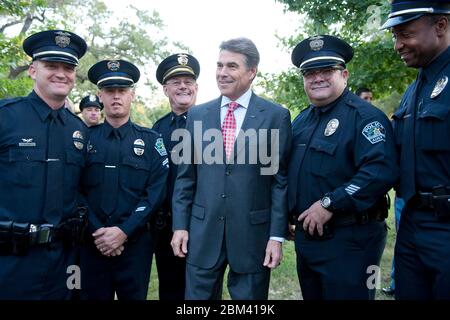 Austin Texas USA, September 11 2011: Texas Gov. Rick Perry commemorates the 10th anniversary of the September 11 terrorist attacks during a memorial ceremony at the Texas State Cemetery's Twin Towers Monument. Perry told the crowd that 'the images still linger in our minds and we will never forget the lives lost that day.'   ©Bob Daemmrich Stock Photo