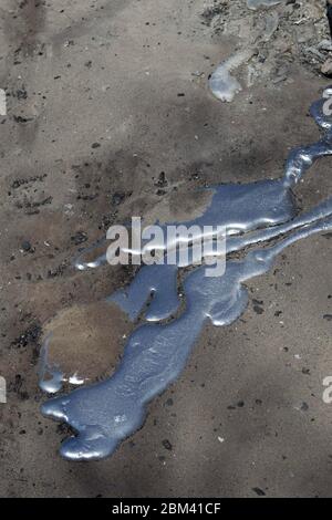 Bastrop County, Texas USA, September 9 2011: Melted aluminum from a garage pools on dirt on the site of a house that was destroyed by the massive wildfires that swept through this wooded Circle D neighborhood. ©Bob Daemmrich Stock Photo