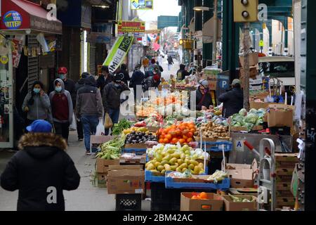 People wearing face masks in Corona, Queens, one of the harder hit neighborhoods of the coronavirus COVID-19... SEE MORE INFO FOR FULL CAPTION Stock Photo