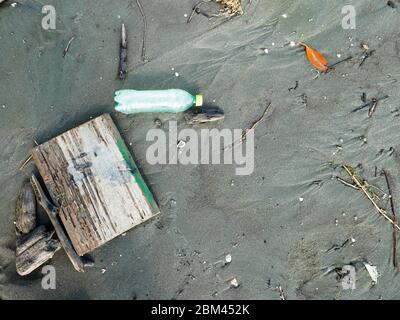 Plastic soda bottle discarded contaminating the beach in cartagena colombia copy space Stock Photo