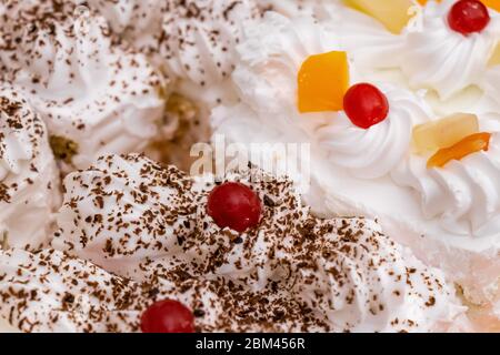 Tasty piece of chocolate vanilla cake pastry closeup, selective focus.