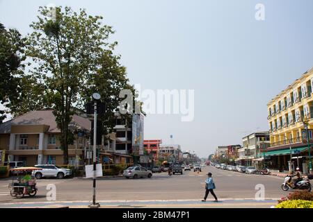 NAKHON PHANOM, THAILAND - OCTOBER 2 : Thai people and foreign travelers drive car and ride motorcycle and bike bicycle on traffic junction at Nityo ro Stock Photo