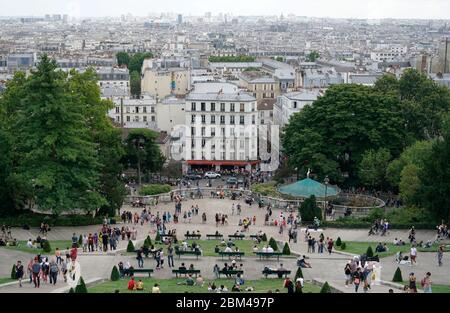 The view of city of Paris with visitors in Louise Michel Square in foreground from Basilique du Sacré-Cœur de Montmartre.Paris.France Stock Photo