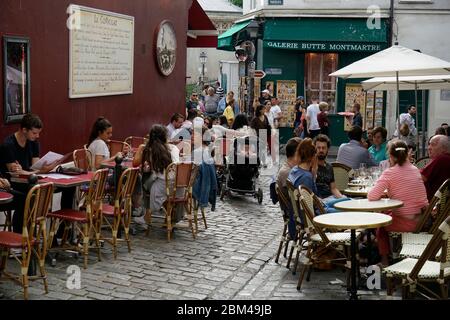 Outdoor restaurant cafe with customers in Montmartre.Paris.France Stock Photo