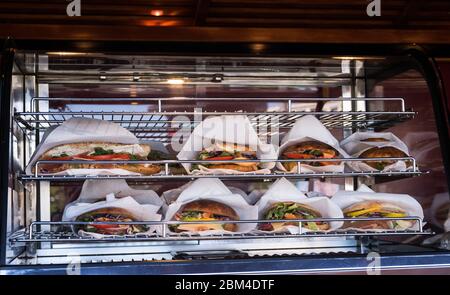 Sandwiches display during fast food festival outdoor event. Outside catering. Food Buffet Catering Dining Eating Party Sharing Concept. Meat, bacon, c Stock Photo