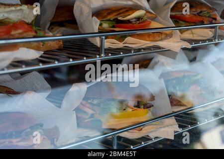 Sandwiches display during fast food festival outdoor event. Outside catering. Food Buffet Catering Dining Eating Party Sharing Concept. Meat, bacon, c Stock Photo