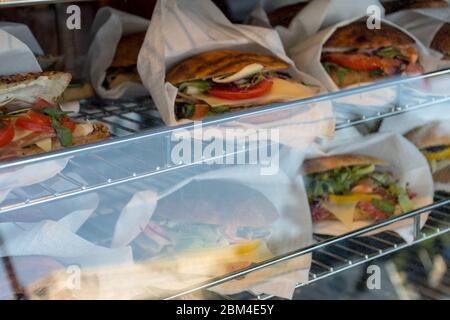 Sandwiches display during fast food festival outdoor event. Outside catering. Food Buffet Catering Dining Eating Party Sharing Concept. Meat, bacon, c Stock Photo