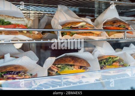 Sandwiches display during fast food festival outdoor event. Outside catering. Food Buffet Catering Dining Eating Party Sharing Concept. Meat, bacon, c Stock Photo