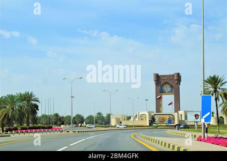 Clock Tower (Burj Al Sahwa) an iconic landmark. Al Sahwa Clock Tower 'Burj Al Sahwa'. Muscat, Sultanate Of Oman.Oman highway roads. oman city road. Stock Photo