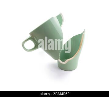 Broken coffee mug on white background, broken cup pieces, Broken relationship and Parting concept Stock Photo