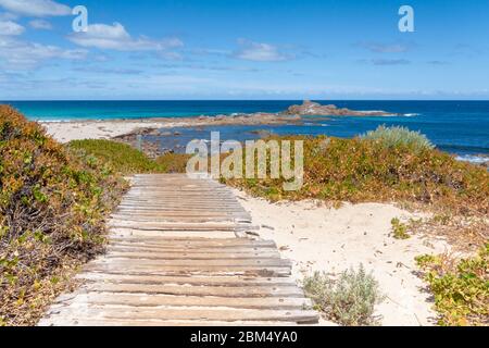 Wooden path through the dunes to the beach Stock Photo