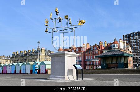 Brighton UK 7th May 2020 - Runners pass by Hove Plinth Constellation  on a beautiful sunny morning during the Coronavirus COVID-19 pandemic crisis . The weather is forecast to be hot and sunny over the next few days before turning cooler at the weekend . Credit: Simon Dack / Alamy Live News Stock Photo
