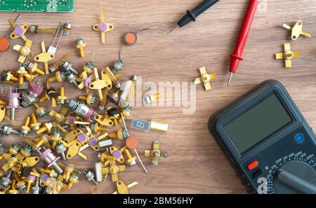 Multimeter and power supply cables. conducting tests and electrical measurements. electronics repair.  Stock Photo