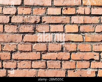textured construction background - outdoor wall of old from house from brown bricks Stock Photo