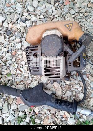 Parts from broken motos. Petrol trimmer disassembled. Stock Photo