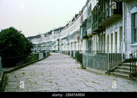 Bristol in the 60s and 70s: View along Royal York Crescent in Clifton, Bristol, in June 1970 when some of the buildings had been split into student flats and rented out to Bristol University undergraduates.  The Clifton area was popular with students in those pre-central heating days with many flats available on yearly lets at prices affordable to undergraduates. Stock Photo