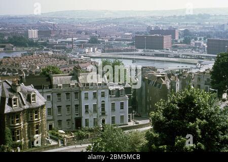 Bristol in the 60s and 70s:  View from Royal York Crescent in Clifton towards the city docks, showing buildings in Cornwallis Crescent split up into flats rented by Bristol University students in the sixties and seventies.  In the background, part of the Cumberland Basin road system, which opened in 1965, and the bonded warehouses built in the early 20th century to cater for a tobacco import boom as cigarette prices fell and sales increased following the development of cigarette-making machines. This photograph was taken in June 1970. Stock Photo