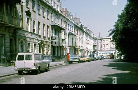 Bristol in the 60s and 70s:  West Mall in Clifton, looking up towards The Mall in June 1970, before parking pressures and controlled parking zones.  The area was popular with Bristol University students in those pre-central heating days with many buildings split into flats and rented out on yearly lets. Stock Photo