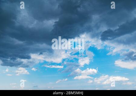 Dark storm clouds before rain at sunset. Weather changes. Stock Photo