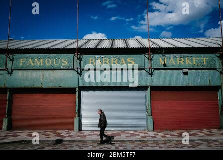 Man walking in Barrowland market, Glasgow, UK, during Corona Virus lockdown. Stock Photo