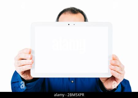 man holding a tablet with a blank screen Stock Photo