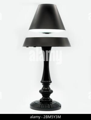 A modern led floating lamp with a floating top, cut out on a white background Stock Photo
