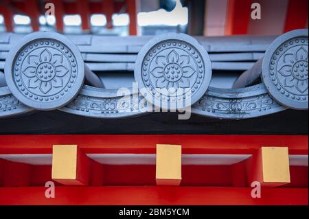 Close-Up detail of traditional Japanese gatou roof decorated with emblems called Kamon or Mon. which are similar to badges or coats of arms, Stock Photo