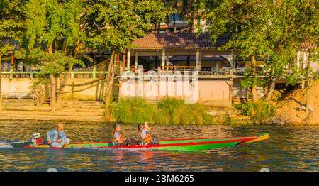 Asian tourist couple on long tail boat river tour, Nam Song, Song river, Vang Vieng, Laos Stock Photo