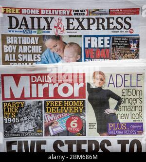 Copies of the Daily Express and Daily Mirror newspapers. The publisher behind the Mirror and Express newspapers has revealed a slump in advertising revenues as companies rein in spending due to the coronavirus outbreak. Stock Photo