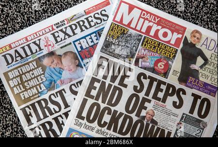 Copies of the Daily Express and Daily Mirror newspapers. The publisher behind the Mirror and Express newspapers has revealed a slump in advertising revenues as companies rein in spending due to the coronavirus outbreak. Stock Photo