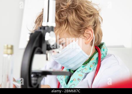 focused young doctor working in a protective mask Stock Photo