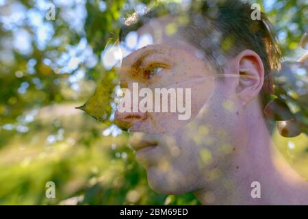 Double exposure of young handsome man with trees and nature Stock Photo