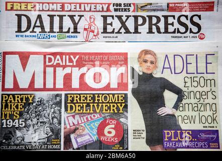 Copies of the Daily Express and Daily Mirror newspapers. The publisher behind the Mirror and Express newspapers has revealed a slump in advertising revenues as companies rein in spending due to the coronavirus outbreak. Stock Photo