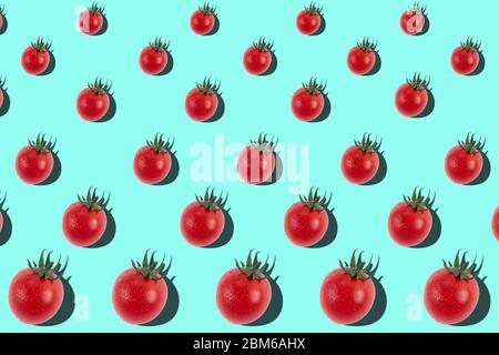 Frash pattern with ripe cherry tomatoes in a geometric order on a bright blue background Stock Photo