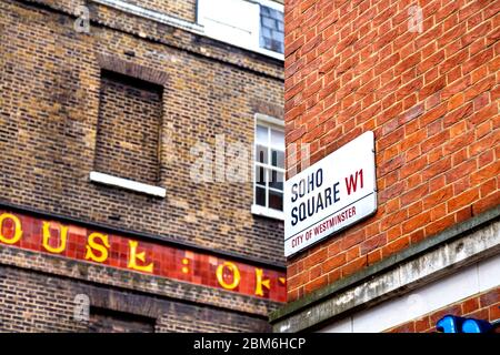 Soho Square street plaque with House of St Barnabas in the background Stock Photo