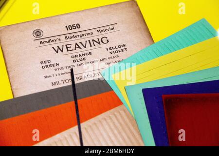 Paper Weaving kit c. 1910 at the 'Play Well' exhibition at the Wellcome Collection, London, UK Stock Photo