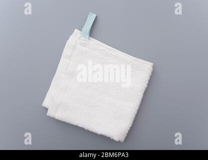 White bath towel on gray background Stock Photo