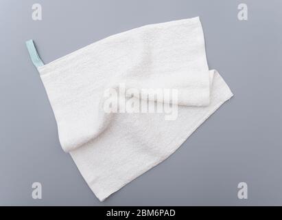 White bath towel on gray background Stock Photo