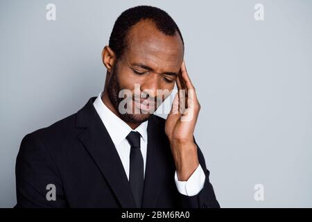 Close-up portrait of nice attractive tired depressed ill guy banker economist employee feeling bad touching temple spasm chronic disease therapy Stock Photo