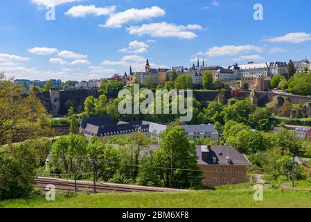 Luxembourg City, a capital immersed in nature, surrounded by green trees on a sunny spring day. View from Parc des Trois Glands in Kirchberg. Stock Photo