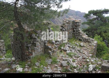 view on Chimera church  ruin  in forest near Yanartash natural vents with perpetual flames. Famous tourist Lician way in Turkey Stock Photo