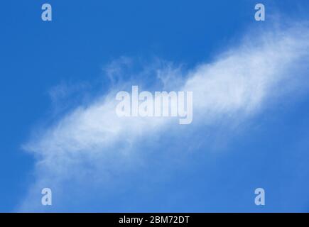 Fuzzy white cloud on blue sky , Finland Stock Photo