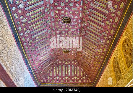 GRANADA, SPAIN - SEPTEMBER 25, 2019:  Islamic style decoration of Gilded Room of Nasrid Palace of Alhambra with carved wooden details, sebka on walls, Stock Photo